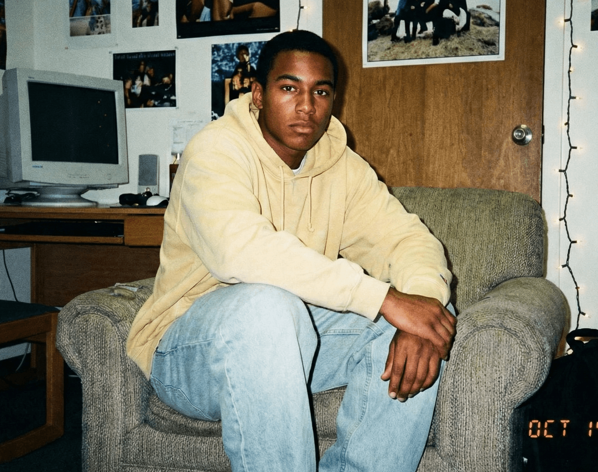 A man styled in colors that flatten his complexion.
